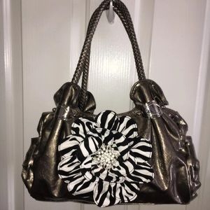 Metallic look purse with large zebra flower